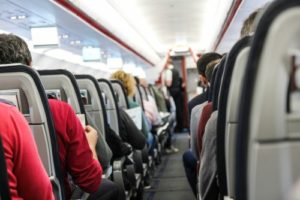 Center aisle of a full airplane