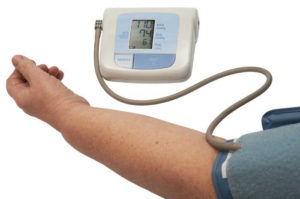 digital blood pressure monitor on a white background